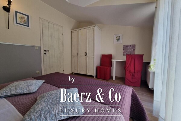 photo 12 Brač, Supetar, a house with a total area of 372 m² located on a plot of 411 m².